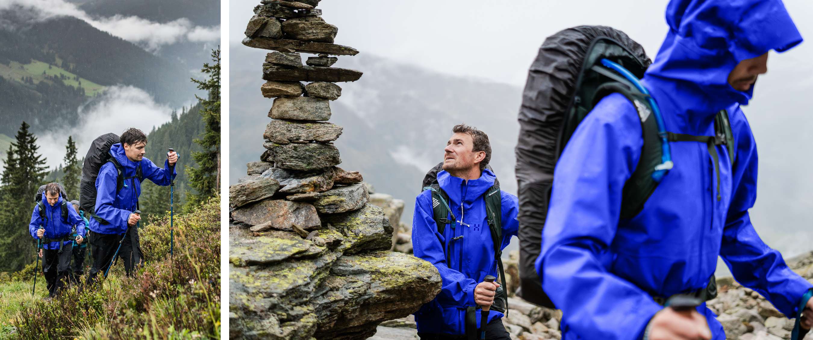 Deux randonneurs en vestes de pluie bleues, avec sacs à dos et bâtons, sur un sentier de montagne rocheux.